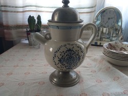 Antique ceramic spout with tin base and lid.