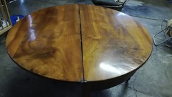 Old round table with roller legs, full folding semicircle forearm.