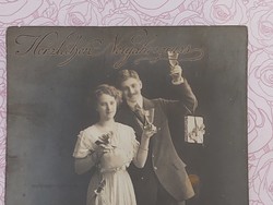 Romantic couple with old Christmas postcard photo postcard