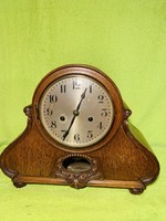 Specially shaped table clock, fireplace clock with a baroque pattern and a beautiful sound