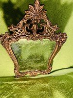 Old metal wall, table mirror, flawless beauty with baroque pattern