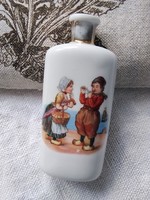 Antique partly hand painted porcelain perfume with Dutch folk costume motif