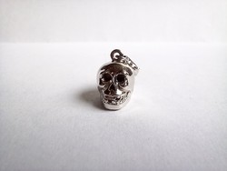 Silver skull shaped charm