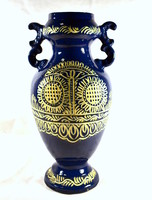 Blue stylized flower pattern with 2 ears marked in a ceramic vase