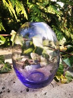 Amethyst in purple glass vase