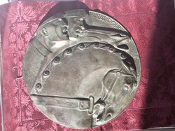 A 30 cm bronze wall decoration from 1915 entitled Vilmos Szamos from Soós. Read......