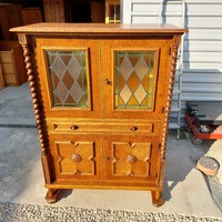 Colonial bar cabinet in nice condition for sale.