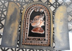 King Matthias fire enamel image behind lion door - mural