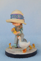 Little girl with ducks. Sarah kay statue with certificate