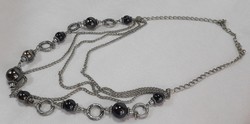 Four-row long black beaded necklace