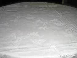 Wonderful antique special spring butterfly on white damask tablecloth