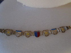 The material of an old but beautifully crafted bracelet is unknown, about 2 cm wide