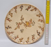 Porcelain wall plate with floral pattern marked 