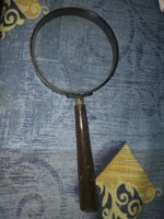 Antique magnifying glass with thick glass and beautiful wooden handle