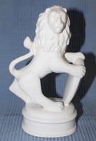 Porcelain lion figure with shield