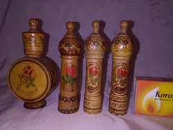 Four jars of rose oil in a wooden box - together