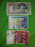Old and older banknotes of French franc totaling 300 francs in one picture