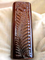 A brown, log-shaped, shiny vase by ditmar urbach?
