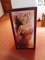 A picture depicting a female figure in a wooden frame