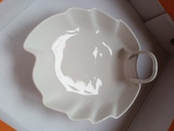 An unmarked porcelain serving bowl is like Herend