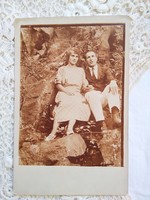 Antique sepia photo of hiking couple in love circa 1910