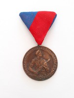 An old medal of the home for the faithful service of the people is a badge