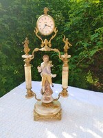 Romantic fireplace clock with onyx base and porcelain statue with mandolinizing putto statue on top