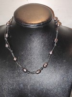 Big-eyed baroque beads on leather