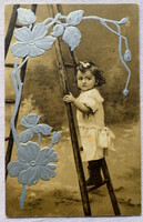 Antique silver embossed greeting graphic postcard with little girl on ladder