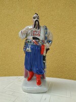 Porcelain sculpture, ornament, pipe man dressed in folk costume for sale!