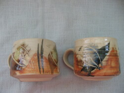 Couple with ceramic mug in studio
