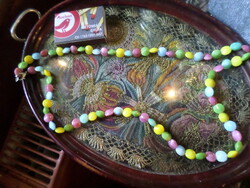 60 Cm candy-like necklace made of colored glass beads.