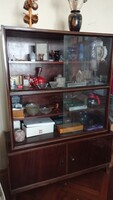 Retro dark brown hardwood showcase with sliding glass cabinet.