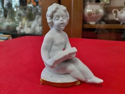 Old Italian capodimonte reading kid porcelain figurine.