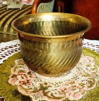 Old brass pot with a special shape and a smaller size