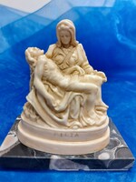 Marble pedestal pieta, painful mother