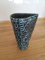 Defective cucumber fish in a ceramic vase