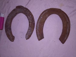 Two pieces of old wrought iron horseshoes - together