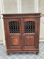 Unique special chest of drawers made of tropical wood with wrought iron insert