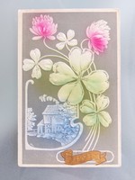 Old embossed postcard postcard with blooming clover cottage