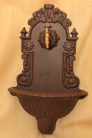 Cast iron wall well with copper tap