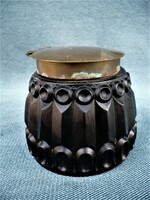 Old dark glass inkwell with heavy copper lid