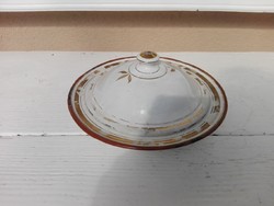 Enameled bowl holding old butter or cottage cheese.