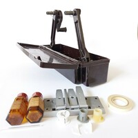 Old film cutter with film glue in vinyl box with supplies