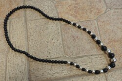 Old black / white plastic pearl necklace