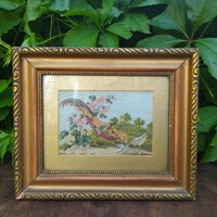 Tapestry in gilded frame
