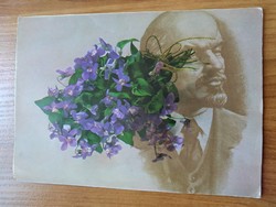 Interesting old postcard with a bouquet of violets and a portrait of lenin