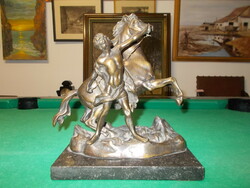 Bronze equestrian statue on a marble base