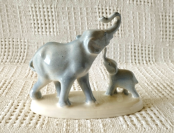 Old marked little granite elephant mother with calf statue, nipple, showcase ornament