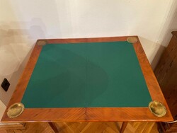 Folding card table with green felt cover